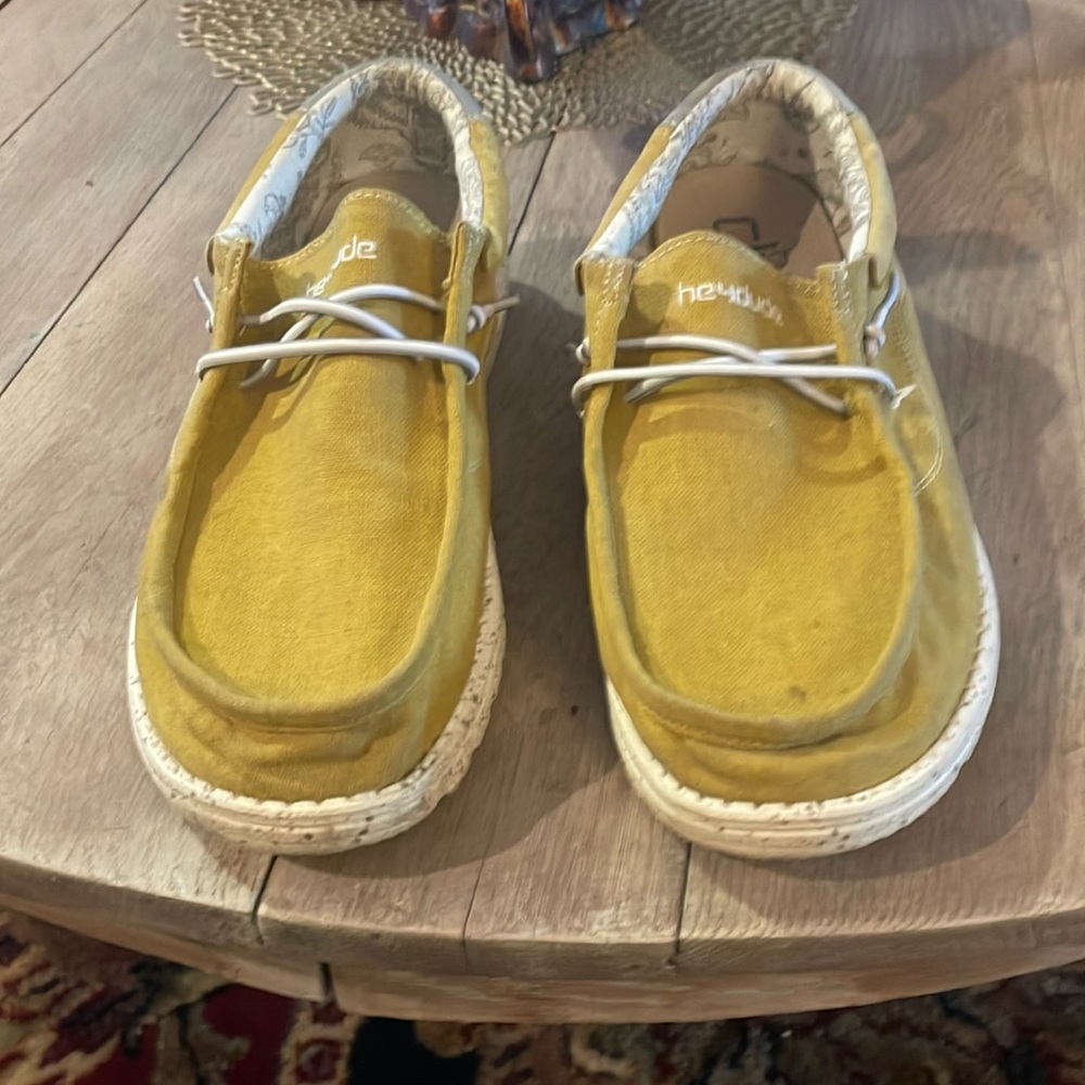 Gold hey dudes worn a few times. Small scuff on right heal